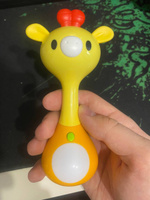 Мягкий прорезыватель для зубов Веселый жираф с умным датчиком движения и подсветкой /Интерактивная музыкальная игрушка-погремушка для новорожденных малышей, ND Play, 299383 #1, Дамир С.